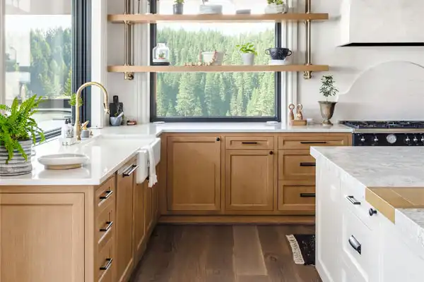 Kitchen with pine trees in the windows