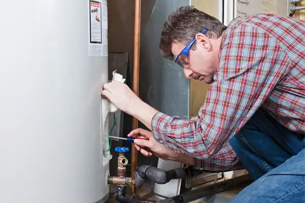 Technician working on water heater